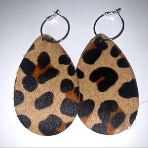 Upcycled cowhide earrings.